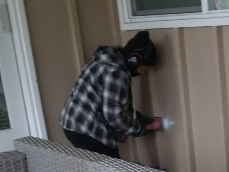 Professional electrician installing an exterior outlet in Albany